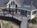 Sunroom with a Trex deck,cable railing and an alum. Pergola