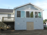 enclosed deck with shed to the backyard