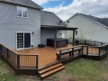 Multi colored Trex deck and railing with alum. Pergola