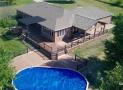 Multi level Trex deck and railing with covered porch & pergola